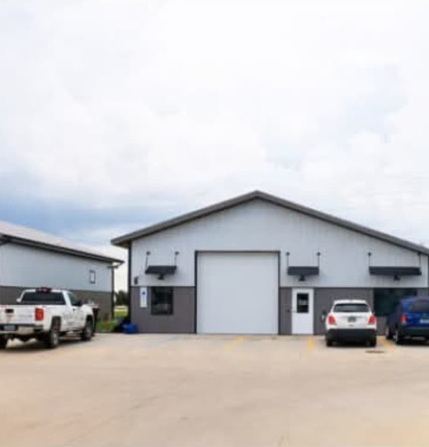 Commercial post-frame building with metal siding