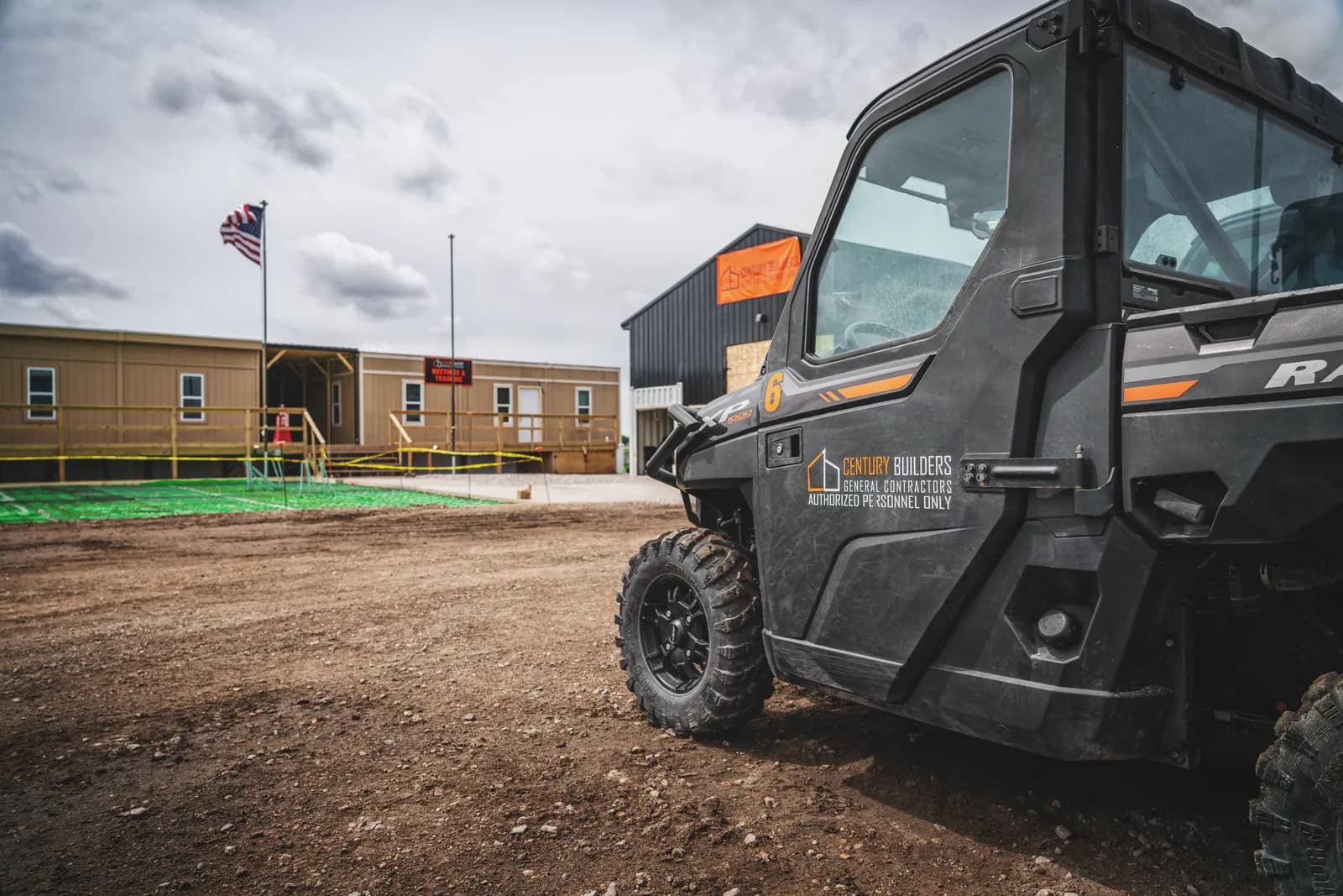 Century Builders site UTV marked authorized personnel only on a jobsite