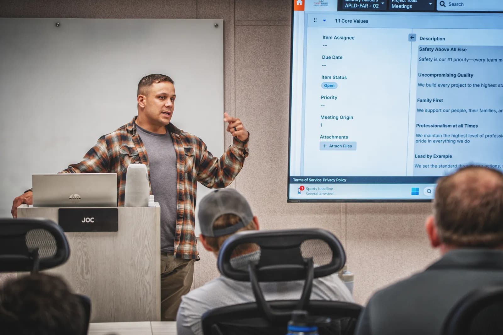Team member leading a safety and core-values standup meeting